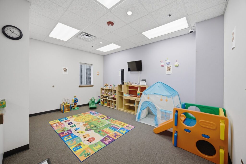 Nursery playroom with toys and play equipment